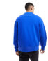 Tommy Jeans relaxed XS badge logo crewneck sweatshirt in blue