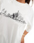 ASOS DESIGN boyfriend fit t-shirt with phoenix cityscape graphic in cream