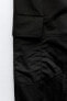 Nylon trousers with zips