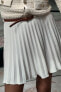 Pleated mini skirt with belt