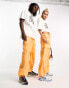 Weekday Unisex parachute baggy trousers in orange exclusive to ASOS