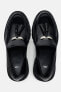 Track sole loafers with tassel detail