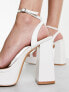 Glamorous platform heel sandals in white patent