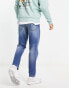 Фото #2 товара ASOS DESIGN tapered fit jeans in dark wash blue - MBLUE