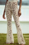 Flared crochet trousers