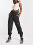 Фото #1 товара Nike Swoosh woven cargo trousers in black