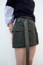 Waxed mini skirt with belt