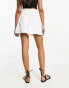 ASOS DESIGN broderie shorts with tie pockets in white