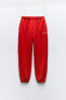 Plush jogging trousers with slogan