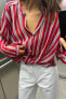 Striped semi-sheer shirt with knot