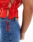 ASOS DESIGN tie side ruched top with puff sleeves in red