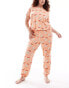 ASOS DESIGN Curve strawberry Cavachon dog tee and cuffed trouser pyjama set in pink