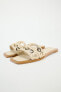 FLAT LEATHER SLIDER SANDALS WITH METAL APPLIQUÉS