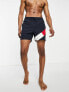 Фото #1 товара Tommy Hilfiger flag leg logo mid length swim shorts in navy