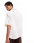 ASOS DESIGN short sleeve relaxed revere collar seersucker shirt with wavy detailing in white