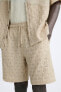 Textured openwork bermuda shorts