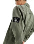 Calvin Klein Jeans monogram logo badge relaxed shirt in olive