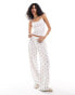 Фото #1 товара ASOS DESIGN strawberry ditsy wide leg trousers in white