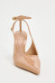 Patent-finish heeled slingback shoes