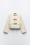 Faux shearling jacket with lobster clasps