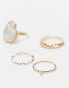 ASOS DESIGN Curve pack of 4 rings with faux pearl design in gold tone