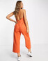 ASOS DESIGN twill strappy halter neck jumpsuit with wide leg in rust