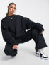 Фото #4 товара Nike mini swoosh extra oversized crop sweatshirt in black and sail