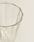 Raised faceted wine glass