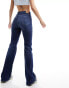 Фото #2 товара Tommy Jeans sylvia high waist flared jeans in mid wash