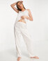 Фото #4 товара Loungeable mix and match satin pyjama trousers in cream with black binding