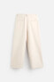 RELAXED FIT PLEATED TROUSERS