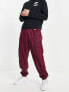 Фото #4 товара Nike Circa Premium winter textured casual trousers dark beetroot red