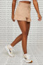 Фото #3 товара Шорты для женщин Nike Fleece с высокой посадкой, расклешенные, бежевые