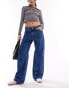 Фото #8 товара Monki Naoki low rise loose fit jeans in classic blue wash