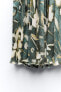 Laminated printed pleated skirt