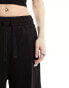 Фото #4 товара Puma Classics ribbed relaxed trousers in black