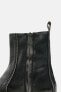 Distressed-effect leather ankle boots