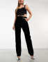 ASOS DESIGN mid rise straight jean with cut out waistband in washed black