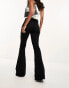 Фото #4 товара ASOS DESIGN power stretch flared jeans in dark blue