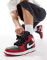 Air Jordan 1 mid trainers in black and red