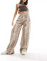 Фото #1 товара Stradivarius STR baggy jean in snake print