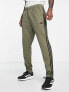 adidas Training Train Essentials 3 stripe joggers in khaki