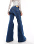 Фото #2 товара Monki Kikki comfort stretch low rise super flared jeans in blue wash