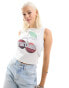 Reclaimed Vintage slash neck vest with cherry print and glitter logo in off white