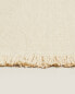 Rectangular wool rug with fringing