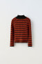Ribbed knit striped sweater