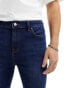 ASOS DESIGN spray on jeans with power-stretch in mid wash blue