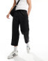 Фото #1 товара ASOS DESIGN wide awkward length nylon trouser with toggle detail in black