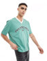 Фото #4 товара ASOS DESIGN oversized t-shirt with v-neck in green with Philadelphia print