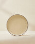 Porcelain dinner plate with antique finish rim